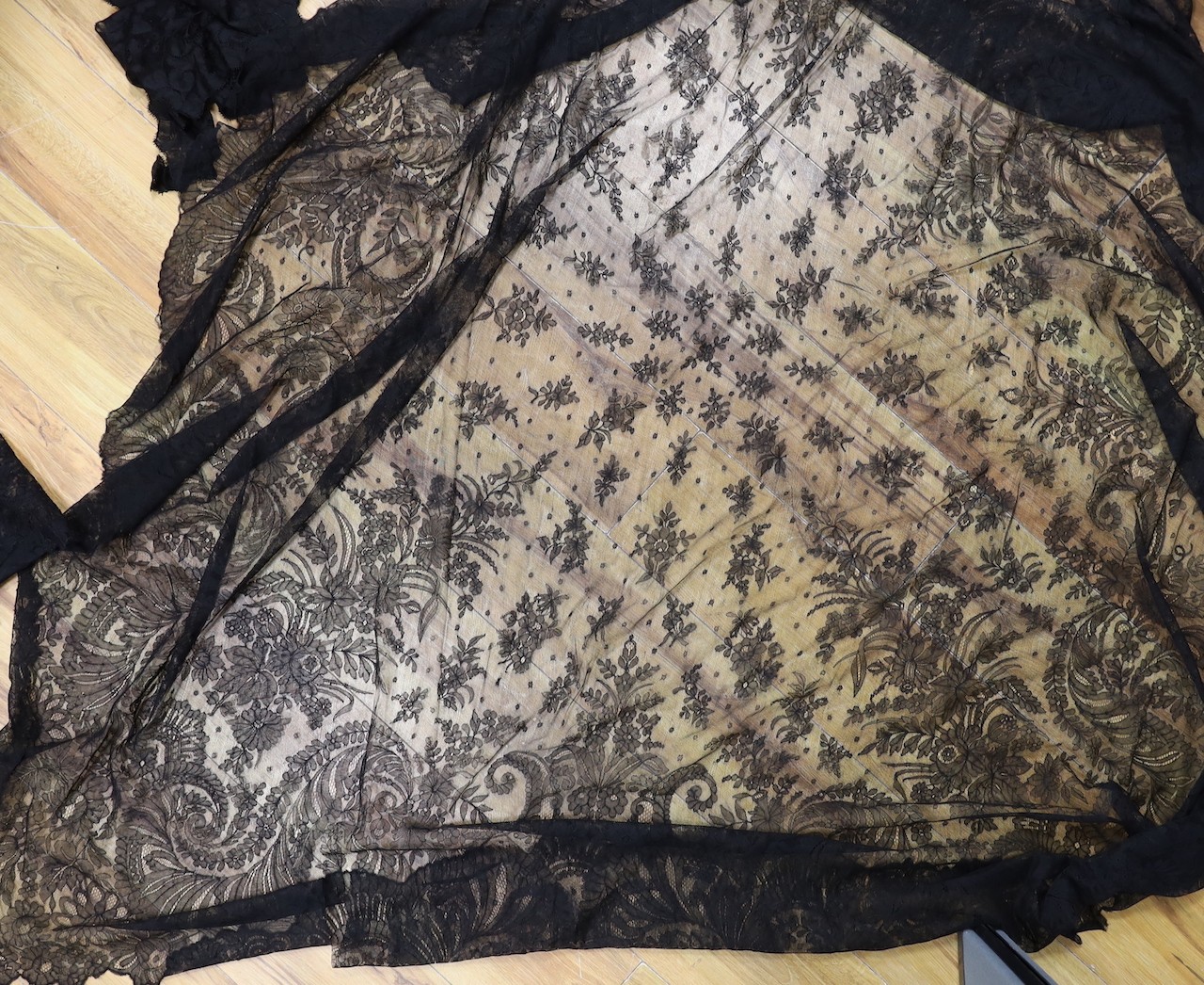 A black lace Matilla, a black lace flounce made into a skirt and a black lace jacket and stole